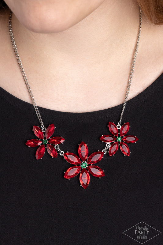 Meadow Muse - Red and Green Flower Necklace - Paparazzi Accessories - Rich red marquise cut rhinestones gather into whimsical flowers dotted with brilliant emerald rhinestone centers. The sparkling red gems are set in pronged settings and connect to a dainty silver chain creating a fanciful display across the collar.