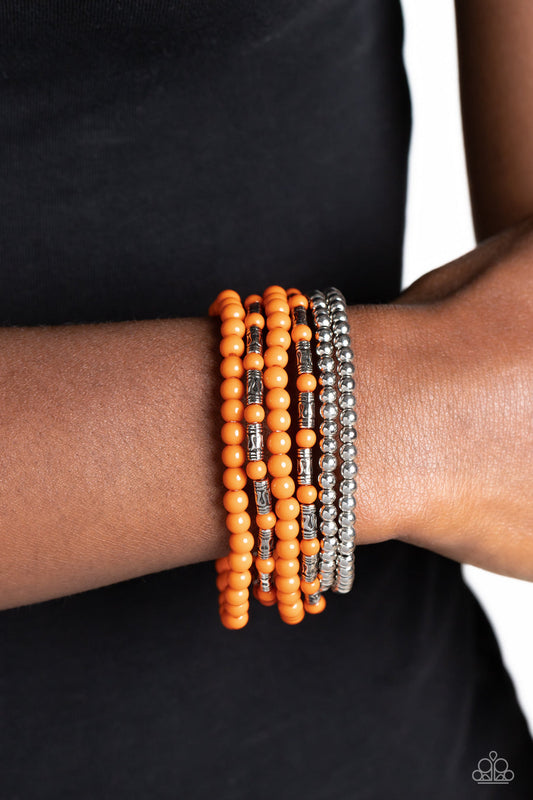 Mythical Magic - Orange Bracelet - Paparazzi Accessories - A trendy collection of orange, silver and silver cylindrical textured beads wrap around the wrist on elastic stretchy bands for a colorful, seasonal stack. Sold as one set of six bracelets.