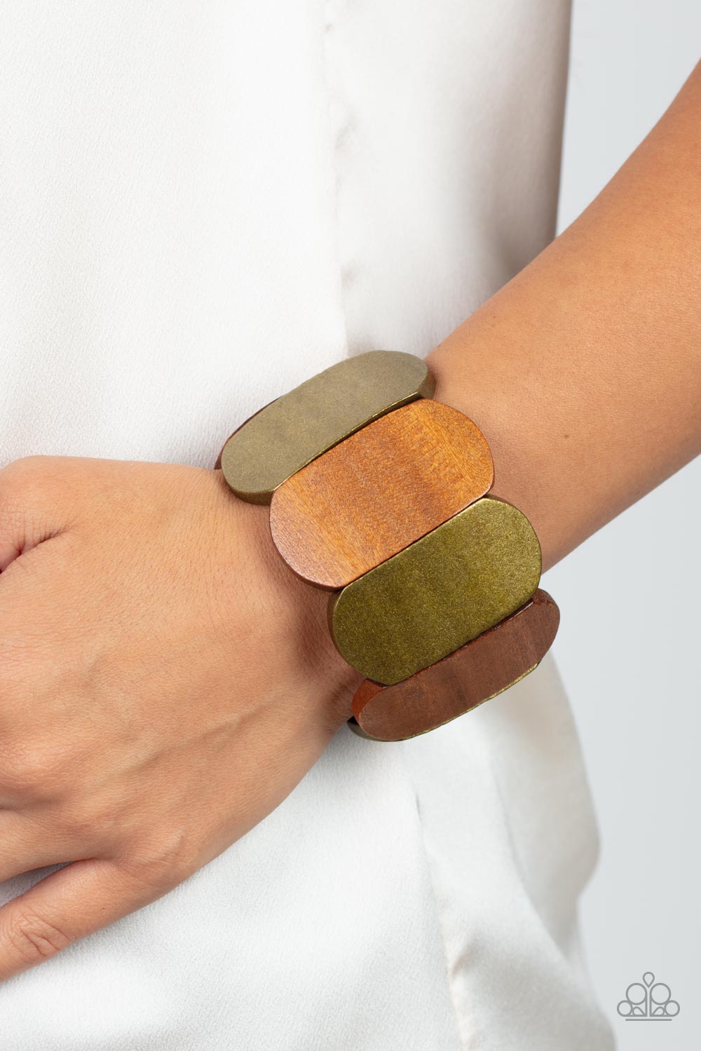 Natural Nirvana - Brass and Brown Wood Bracelet - Paparazzi Accessories - Brushed in a brassy shimmer, smooth wooden panels alternate with natural wood panels threaded along stretchy bands for a naturally balanced display around the wrist.