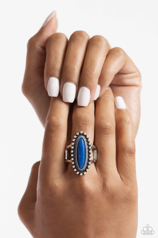 Oblong Occasion - Blue and Silver Ring - Paparazzi Accessories - An oblong lapis stone is pressed into the center of a studded silver band swirling with textured patterns atop airy silver bands for a seasonal finish. Features a stretchy band for a flexible fit. Sold as one individual ring.