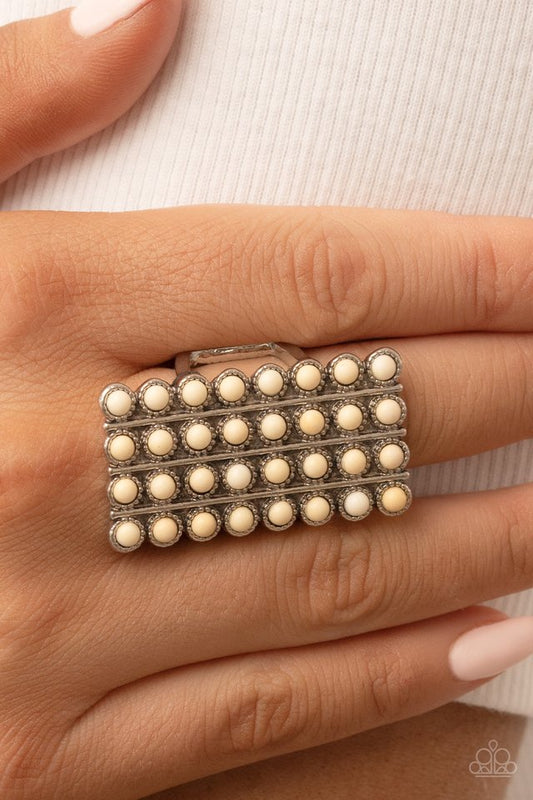 Pack Your SADDLEBAGS - White and Silver Ring - Paparazzi Accessories - Bordered in antiqued silver studs, rows of dainty white stones boldly stack up the finger across the front of an oversized rectangular silver frame for an earthy vibe atop the finger.