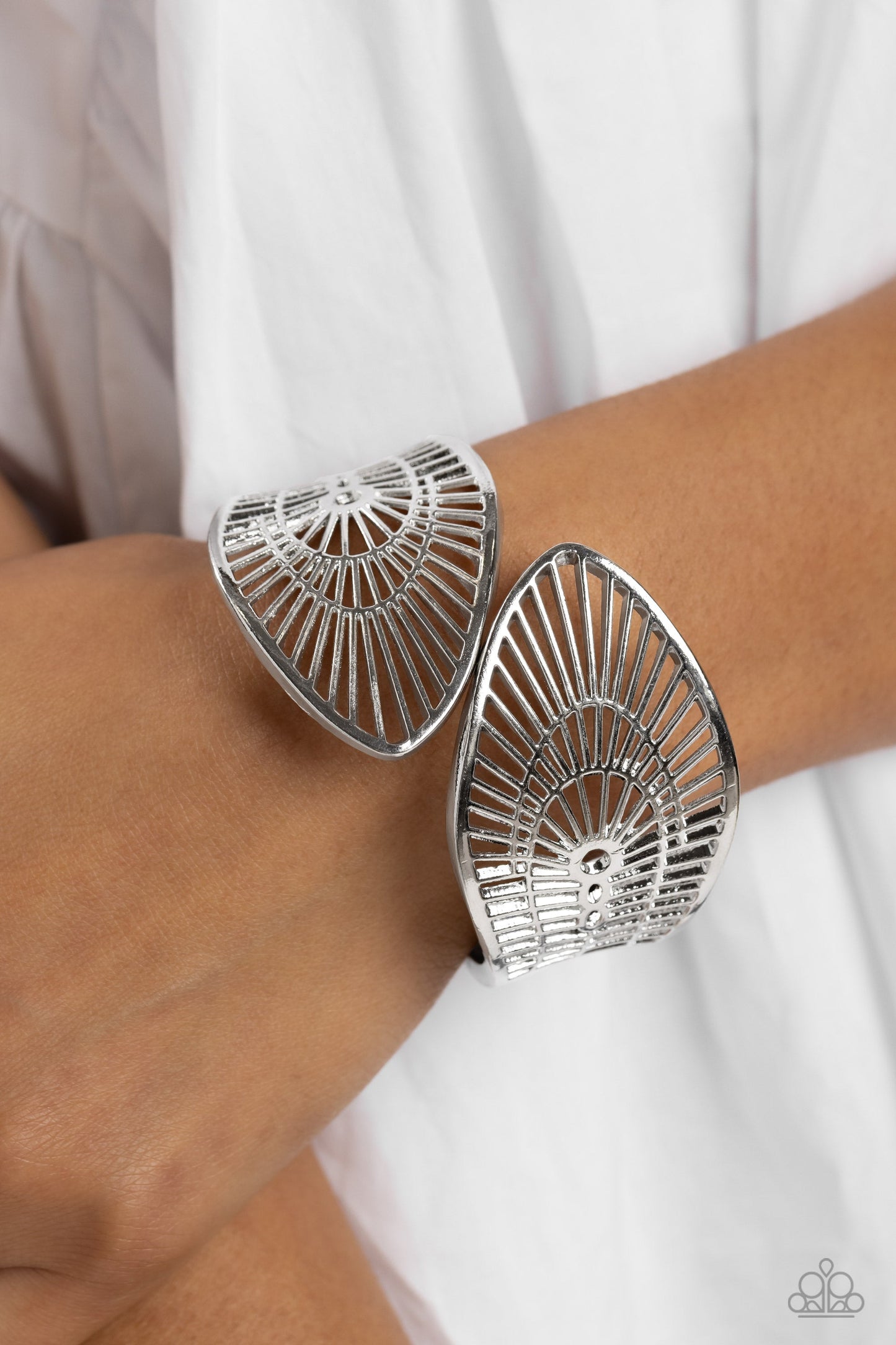 Palatial Palms - Silver Fashion Bracelet - Paparazzi Accessories - Glistening silver bars coalesce into an airy stenciled palm leaf-like bracelet around the wrist for a whimsically metallic look. Features a hinged closure.
