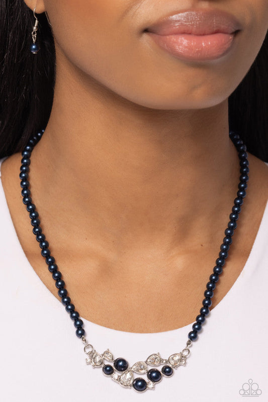 Pampered Pearls - Blue Necklace - Paparazzi Accessories - A single strand of navy pearls elegantly cascades below the collar to meet a refined collection of navy pearls in varying sizes and white gems pressed in round and teardrop frames for a sparkly finish.