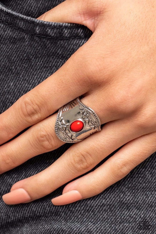 Panoramic Pyramids - Red Ring - Paparazzi Accessories - Dotted with a red oval bead center, a thick silver frame is bordered in studded accents and embossed in rows of pyramidal patterns for an artisan pop of color atop the finger.