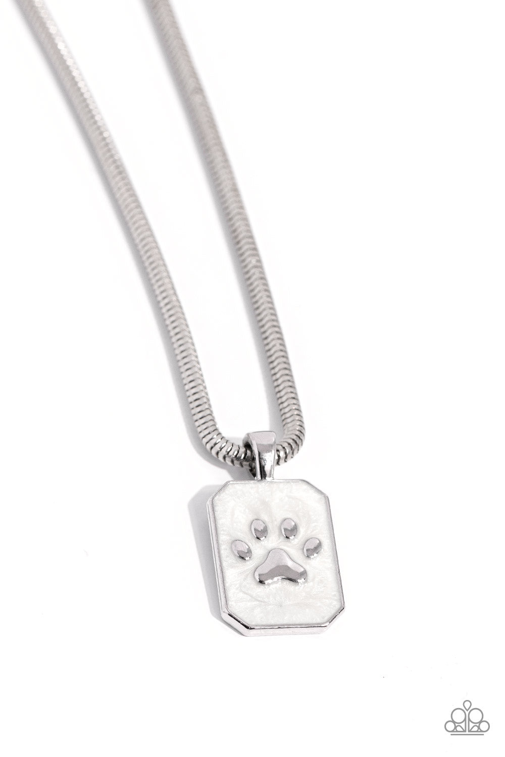 PAW to the Line - Silver Necklace - Paparazzi Accessories - Dangling from a sleek silver snake chain, a rectangular pendant glides down the chest. Featured within the pendant, a silver pawprint, surrounded by white pearl paint creates an elegant pet-inspired pendant.