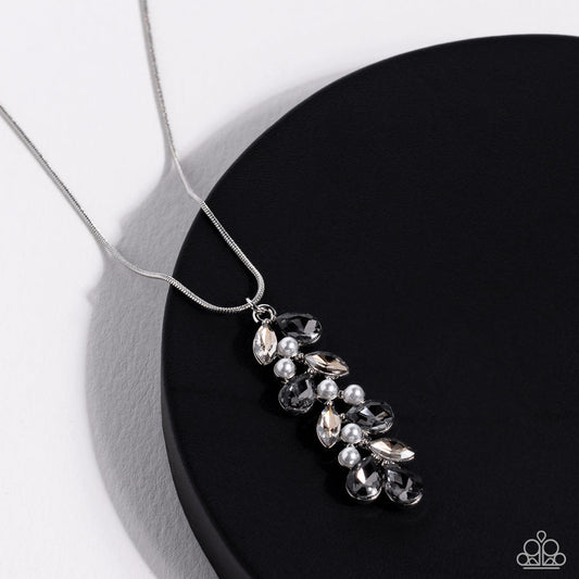 Pearls Before VINE - Silver Necklace - Paparazzi Accessories - Dainty faceted jet black teardrops- and smoky marquise-cut gems climb around clusters of dainty white half-pearls, creating an elongated pendant that slides elegantly along a skinny silver snake chain.