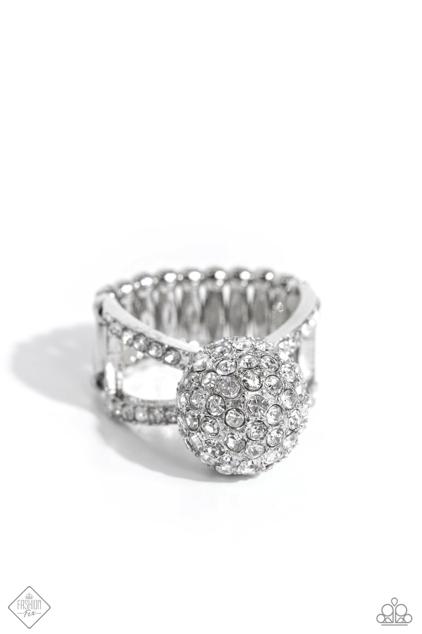 Polished Pageant - White and Silver Ring - Paparazzi Accessories - Dotted in dainty white rhinestones, blinding silver frames delicately crisscross across the finger for a dramatic sparkle. Featured in the center of the sparkly, airy bands, an elevated rhinestone-encrusted silver ornament creates a blinding statement atop the finger. Features a stretchy band for a flexible fit. Sold as one individual ring.