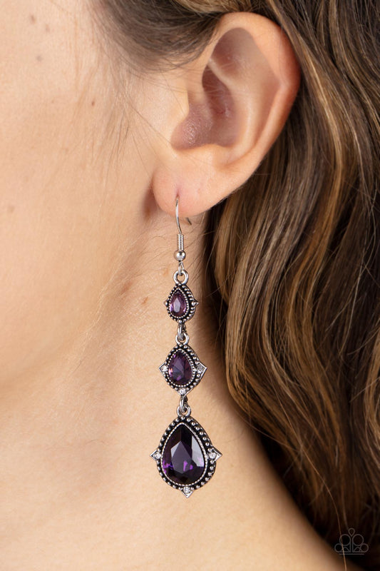 Prague Princess - Purple and Silver Earrings - Paparazzi Accessories - Featuring studded silver frames, a sparkly trio of purple teardrop gems delicately link into a romantic lure. Dainty white rhinestones embellish the edges of the lowermost teardrops, adding a hint of glassy glamour.