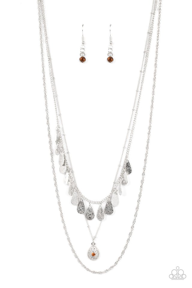 Prairie Dream - Brown and Silver Necklace - Paparazzi Accessories - Classic silver, satellite, and twisted chains daintily layer below the collar. A topaz rhinestone dotted teardrop swings from the middle chain below a fringe of shimmery silver teardrops, resulting in a dreamy display.