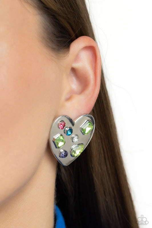 Relationship Ready - Green Multi Color Earrings - Paparazzi Accessories  - Brushed with shimmery pink, white, purple, blue, and green round, teardrop and emerald-cut gems, an oversized, high-sheen silver heart frame rests against the ear for a dazzling finish.