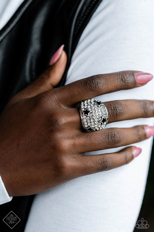 Reliable Radiance - Fashion Ring - Paparazzi Accessories - Row after row of incandescent white rhinestones stack into a dazzling display across a beveled silver band. Silver star silhouettes haphazardly dot across the dazzling surface, creating a commanding statement piece. 