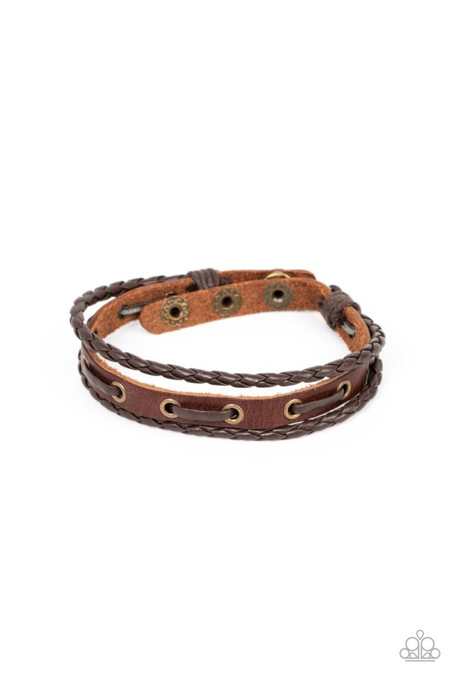 Road Cruise - Brass Brown Urban Bracelet - Paparazzi Accessories - Infused with brown leather laces, a rustic piece of brown leather joins a pair of braided leather cords around the wrist, stacking into an adventurous centerpiece. Features an adjustable snap closure.
