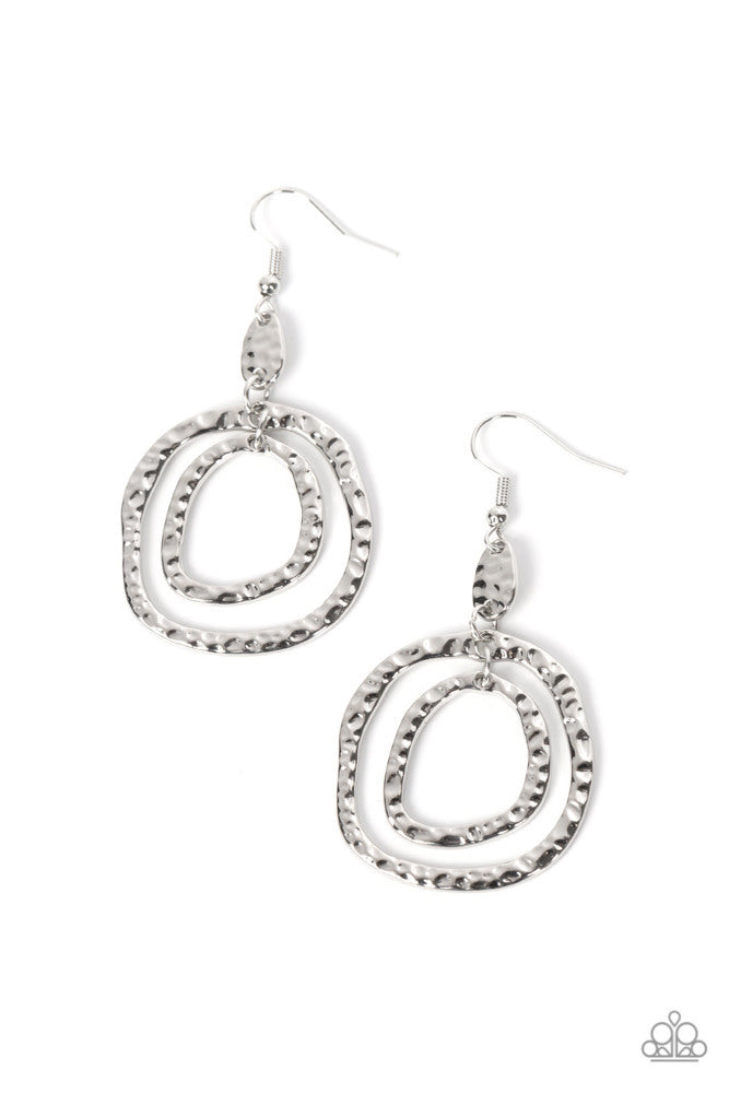 Scalding HAUTE - Silver Earrings - Paparazzi Accessories - Hammered in tactile shimmer, a pair of asymmetrical hoops cascade from the bottom of a matching hammered fitting for an artisan vibe. Earring attaches to a standard fishhook fitting. Sold as one pair of earrings.