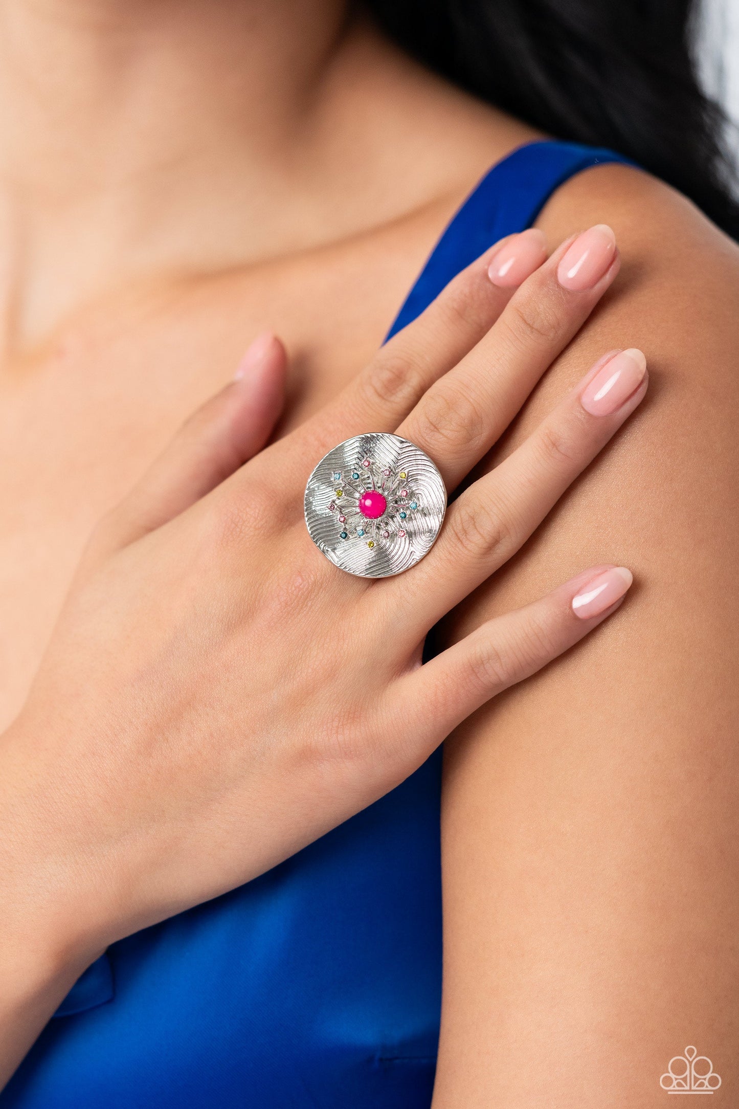 Seriously SUNBURST - Pink and Silver Ring - Paparazzi Accessories - Featuring an oversized, textured backdrop, a dainty 3D sunburst detail, glistening with pink, blue, and olive green rhinestones and a Pink Peacock center standout atop the finger for a sunny pop of color. Features a stretchy band for a flexible fit.
