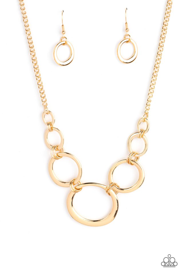 Short Circuit - Gold Necklace - Paparazzi Accessories - An asymmetrical collection of flat gold hoops delicately links with dainty gold rings below the collar. Attached to a classic gold chain, the dizzying rings gradually increase in size for added dimension.