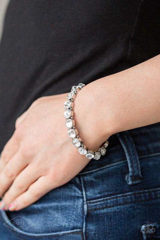 Sugar-Coated Sparkle - White Bracelet - Paparazzi Accessories - Infused with dainty silver beads, glassy white rhinestone encrusted frames are threaded along stretchy bands around the wrist for a glamorous look.