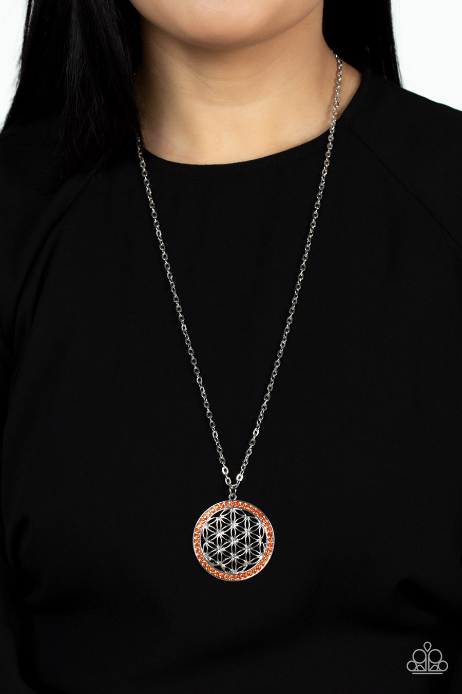 Tearoom Twinkle - Orange and Silver Necklace - Paparazzi Accessories - Bright dainty Sun Orange rhinestones create a brilliant round frame brimming with airy floral petals, coalescing into a charming medallion that sways from the bottom of a lengthened silver chain.