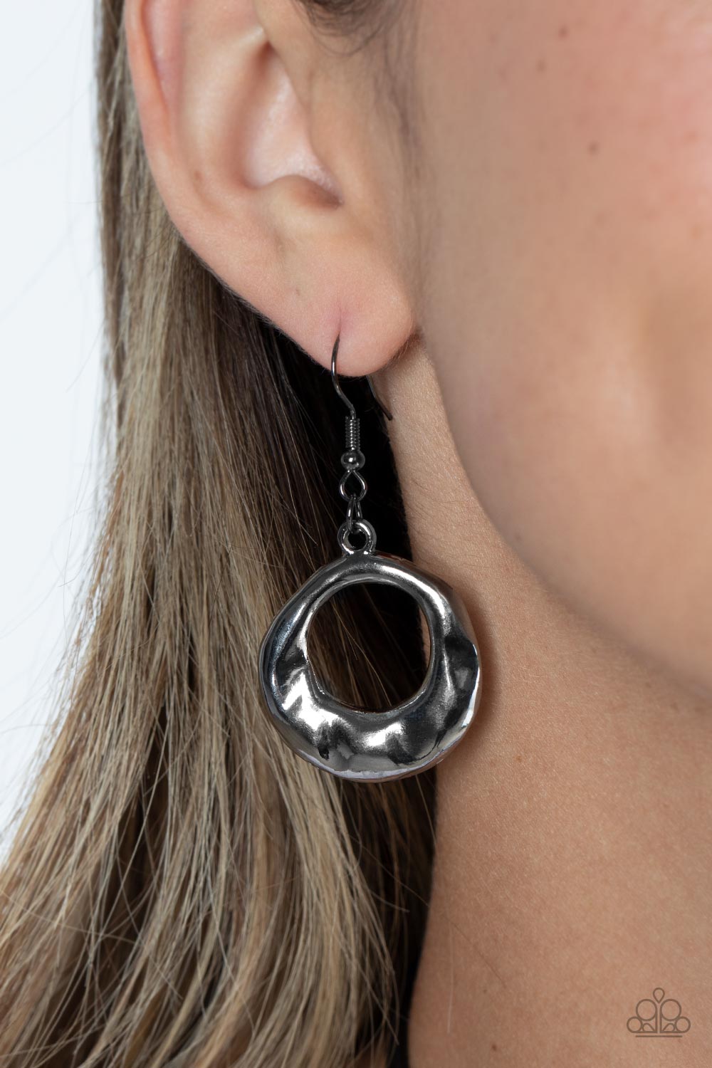 Tectonic Treasure - Black Gunmetal Necklace - Paparazzi Accessories - An oversized, oblong, gunmetal hoop rippling with hammered textures swings from the bottom of a collection of black cording. A single gunmetal bead glides down the bottom of the cording for a dramatic industrial look, anchoring the cording to the hoop.