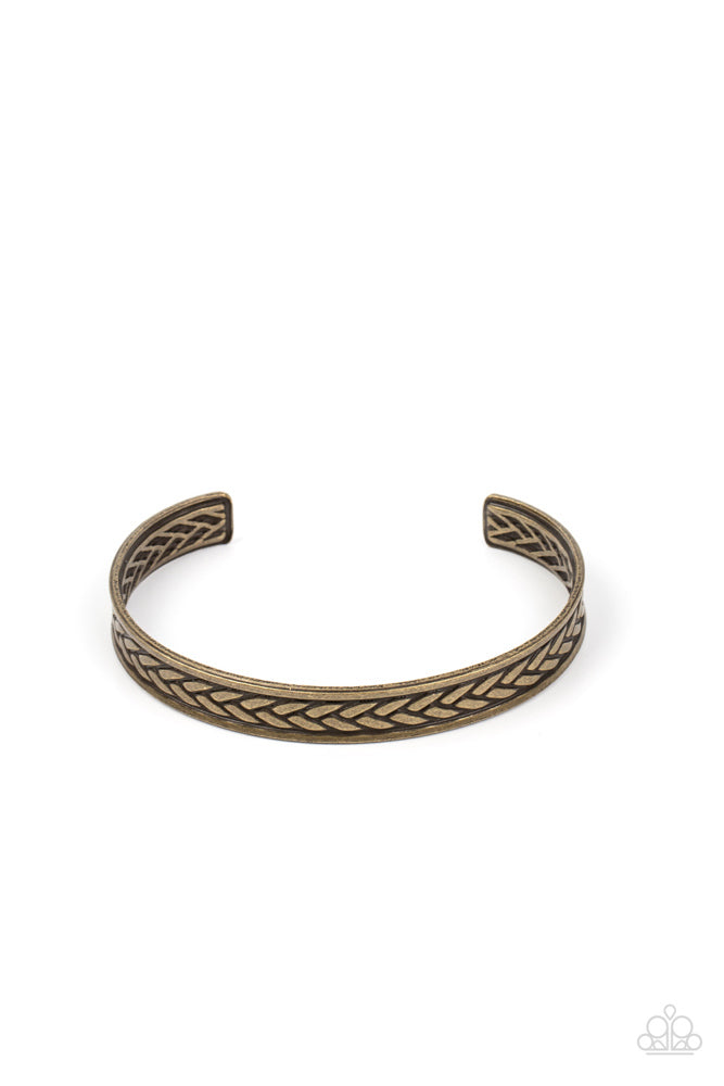 Terra Tread - Brass Urban Bracelet - Paparazzi Accessories - An antiqued tread-like pattern is embossed down the center of a dainty brass cuff, resulting in a gritty edge around the wrist.