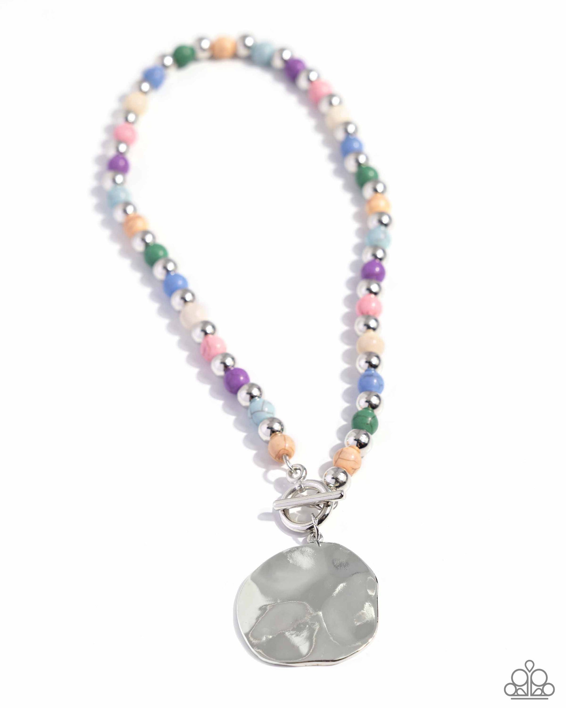 Textured Trinket - Multi Color Necklace - Paparazzi Accessories - Infused along an invisible string, colorful stones alternate with high-sheen silver beads as they connect through a toggle closure. A hammered oversized concaved silver disc cascades from the colorful strand for additional eye-catching detail. Features a toggle closure.