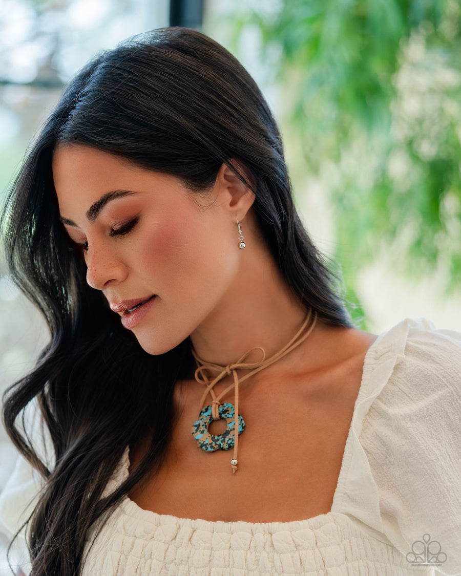 Tied Triumph - Brown Necklace - Paparazzi Accessories - Featuring brown and black marbling, an airy turquoise flower is knotted at the bottom of a lengthened strand of brown suede for a southwestern-inspired statement. Features an adjustable tie closure.