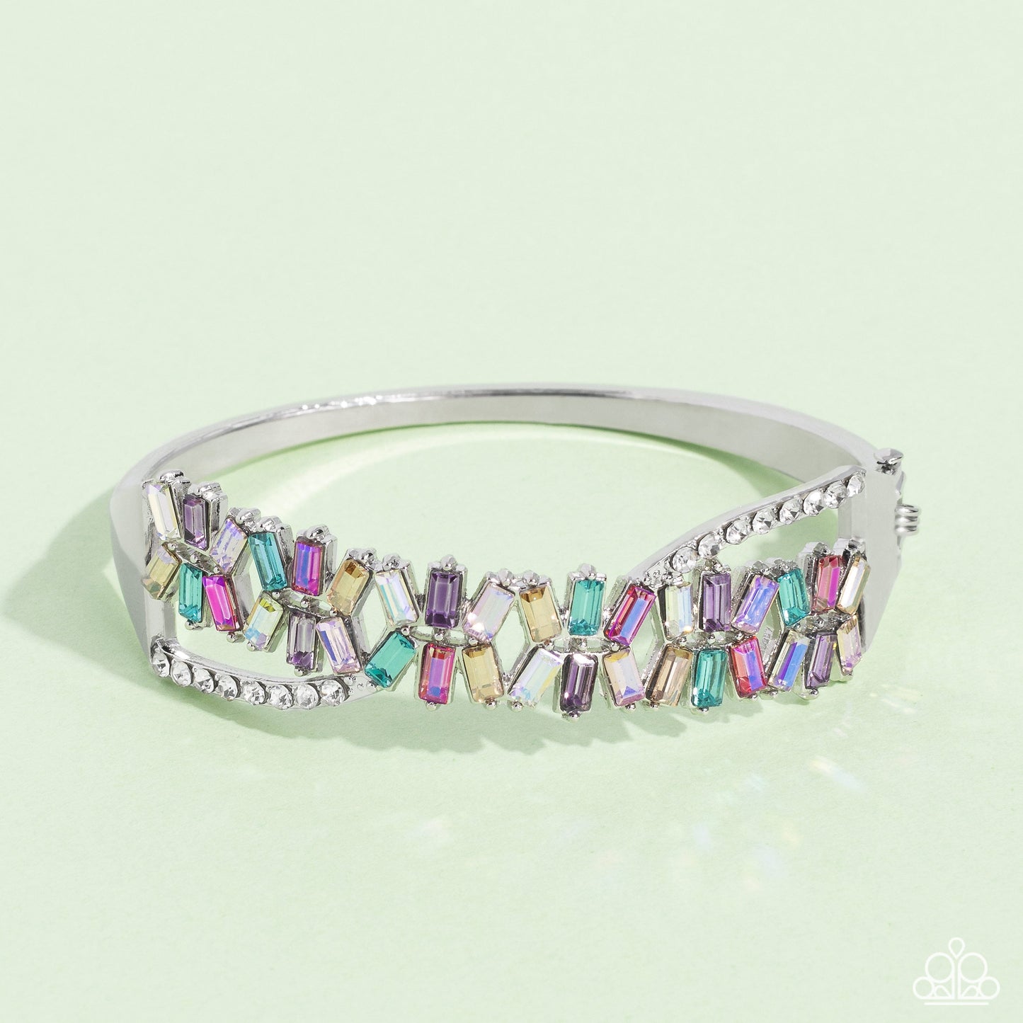 Timeless Trifecta - Multi Color Hinge Closure Bracelet - Paparazzi Accessories - Modeled after the infinity symbol curves, a row of dainty white rhinestones playfully interacts with emerald-cut gems splashed in shades of amethyst, light blue, pink, smoked topaz, and iridescence. Set in clusters of three, the emerald-cuts haphazardly stack on top of one another for a timeless, geometric radiance atop the wrist.