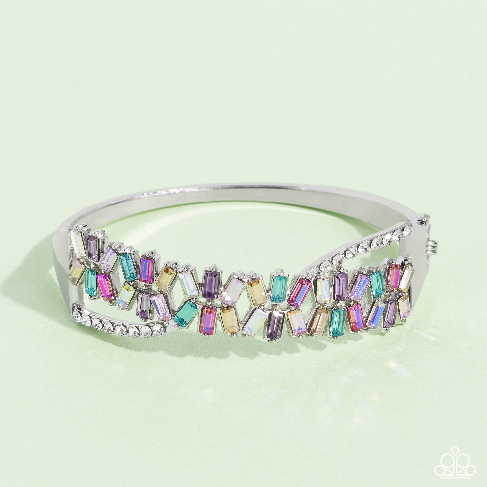 Timeless Trifecta - Multi Color Hinge Closure Bracelet - Paparazzi Accessories - Modeled after the infinity symbol curves, a row of dainty white rhinestones playfully interacts with emerald-cut gems splashed in shades of amethyst, light blue, pink, smoked topaz, and iridescence. Set in clusters of three, the emerald-cuts haphazardly stack on top of one another for a timeless, geometric radiance atop the wrist.
