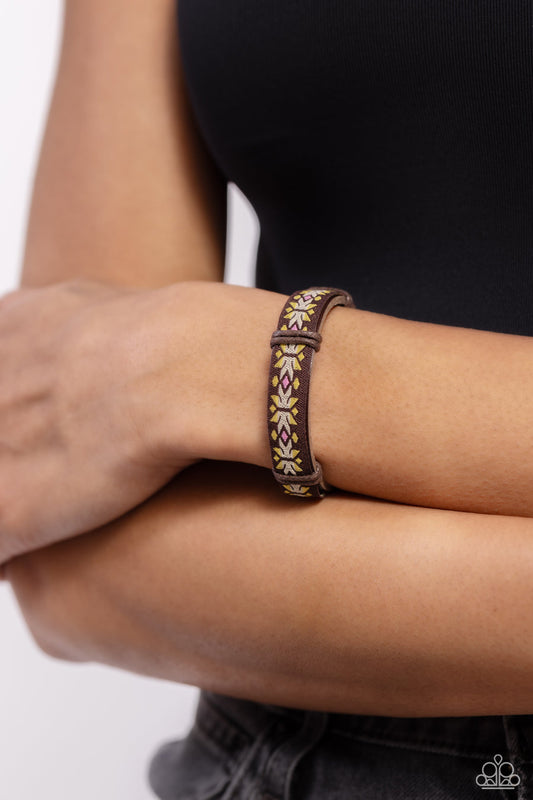 Trailblazing Textiles - Yellow Brown Urban Leather Bracelet - Stitched in a colorful southwestern inspired textile pattern, a brown ribbon is knotted in place across the front of a brown leather band for an adventurous vibe.