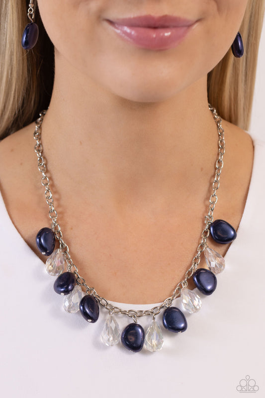 Welcome to BALL Street - Blue and Silver Necklace - Paparazzi Accessories - White crystal-like teardrops and oversized Montana baroque pearls drip from the bottom of a shimmery silver link chain, creating a refined fringe below the collar.