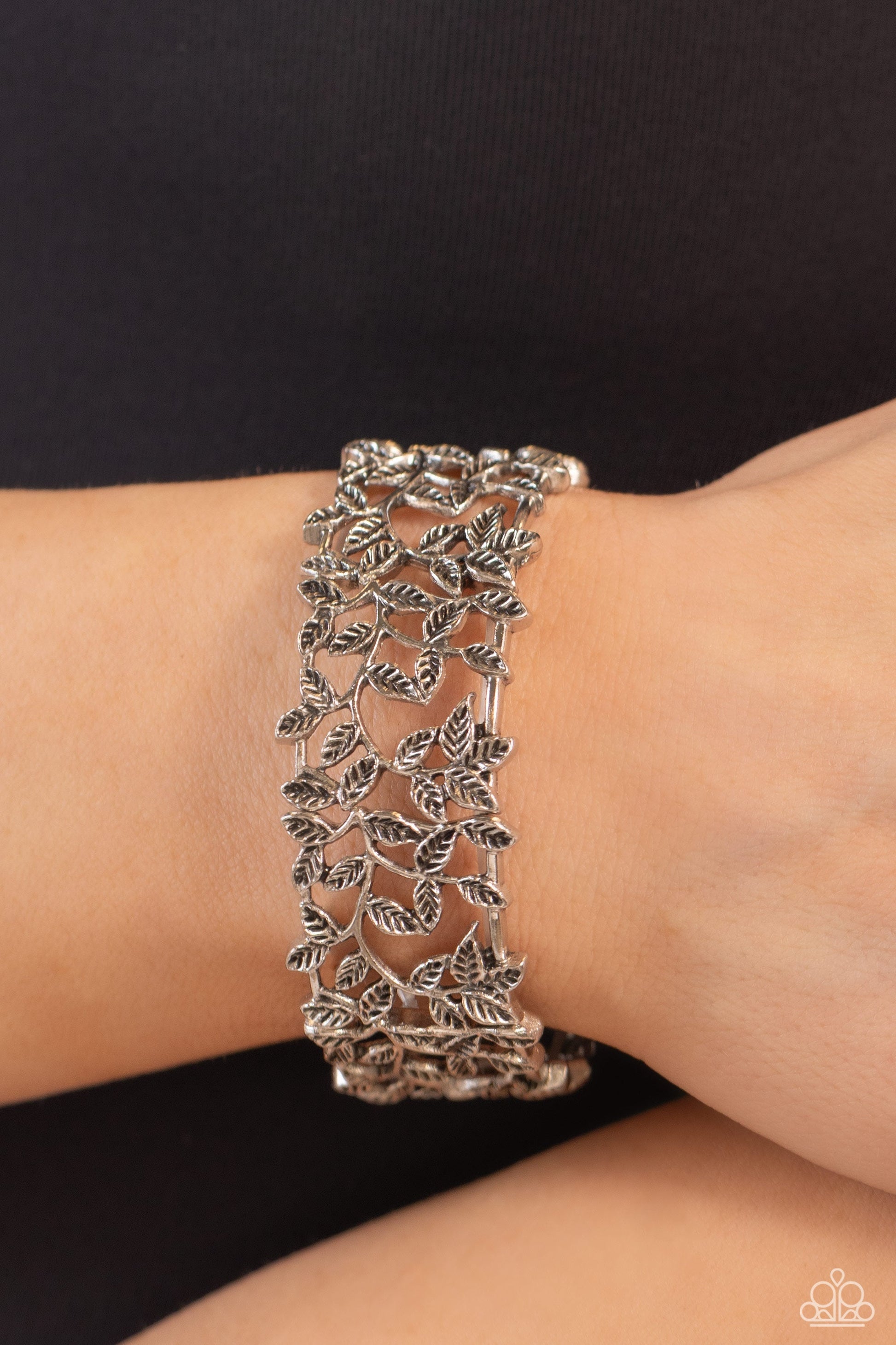 Whose Vine Is It Anyway? Silver Bracelet - Paparazzi Accessories - Dotted with intricate textures, shiny silver filigree vines with tactile leaves, as they twist and wind across the wrist on elastic stretchy bands for a whimsical look. 