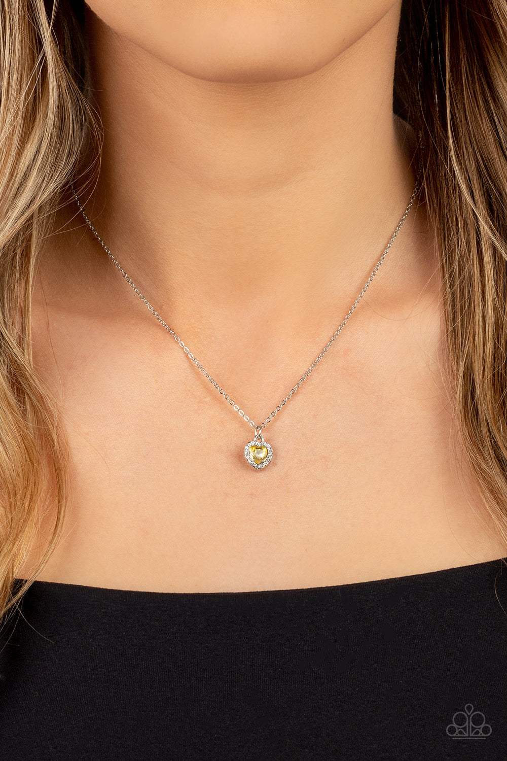 A Little Lovestruck - Yellow and Silver Heart Rhinestone Necklace - Paparazzi Accessories - Dainty yellow rhinestone heart sparkles along a dainty silver chain below the collar for a flirtatious fashion.