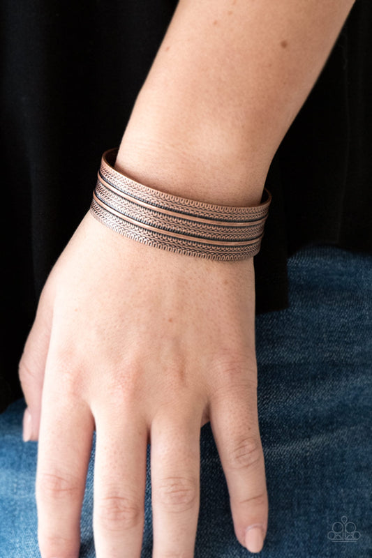 Absolute Amazon - Copper Cuff Bracelet - Paparazzi Accessories - 
Stamped in tribal-inspired patterns, an antiqued copper cuff wraps around the wrist for an indigenous look.
Sold as one individual bracelet.