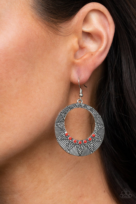 Adobe Dusk - Red and Silver Earrings - Paparazzi Accessories - Dainty red beads, a radiant sunburst pattern is stamped across a silver hoop for a colorfully seasonal look. Earring attaches to a standard fishhook fitting. Trendy fashion jewelry for everyone.