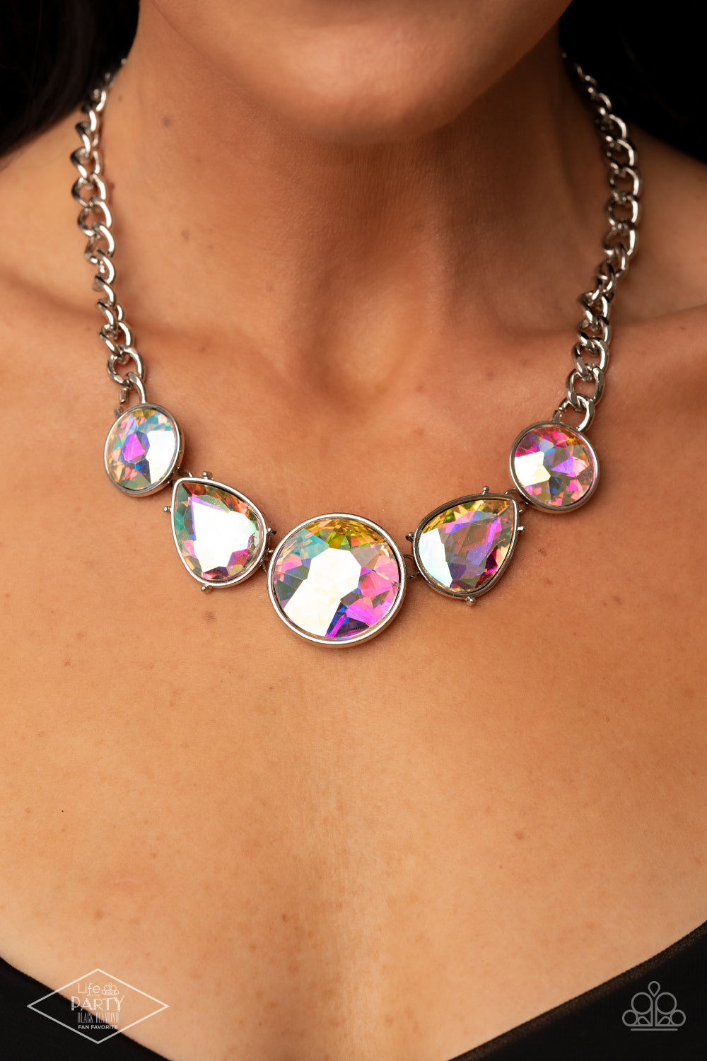 All The Worlds My Stage - Multi Color Iridescent - Silver Teardrop Necklace - Paparazzi Accessories - Infused with heavy silver chain, an exaggerated display of round and teardrop shaped iridescent rhinestones connects below the collar for a blinding look. Features an adjustable clasp closure.