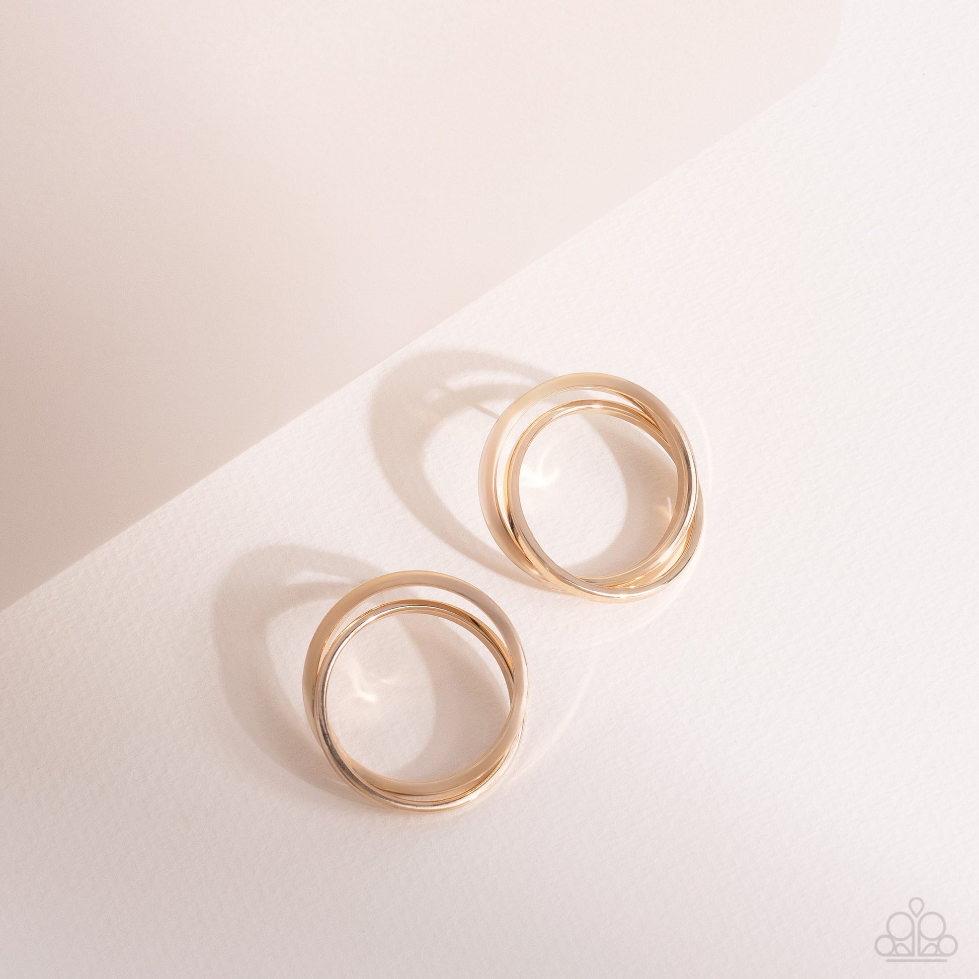 Always In The Loop - Gold Earrings - Paparazzi Accessories - Thick gold rings intricately interlock into a stacked frame for an edgy look. Earring attaches to a standard post fitting. Sold as one pair of post earrings.
