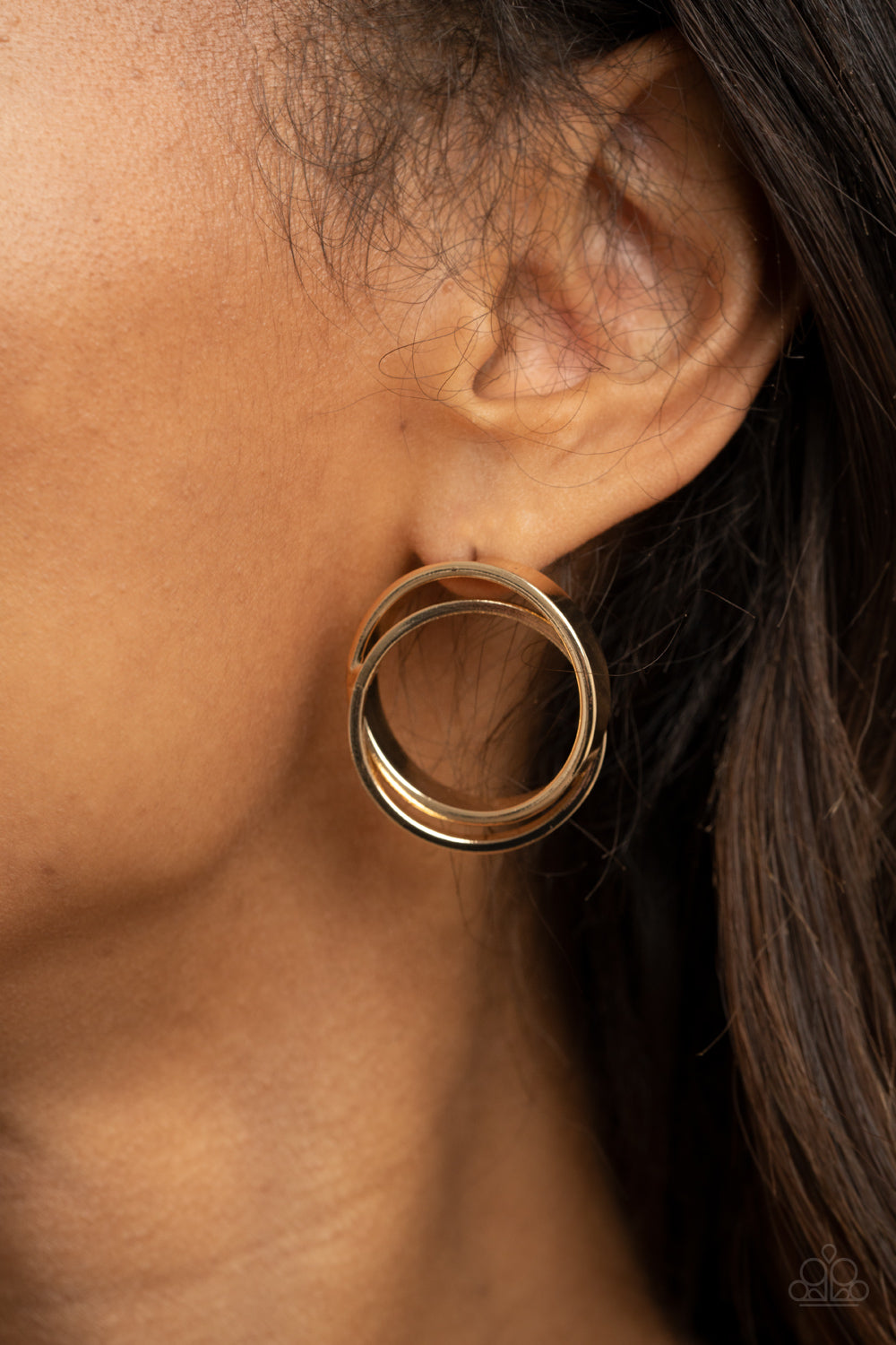 Always In The Loop - Gold Earrings - Paparazzi Accessories - Thick gold rings intricately interlock into a stacked frame for an edgy look. Earring attaches to a standard post fitting. Sold as one pair of post earrings.