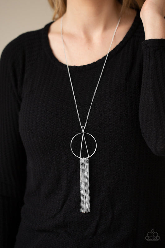 Apparatus Applique Silver Necklace - Paparazzi Accessories - Two silver rods delicately overlap at the top of a glistening silver hoop, creating an abstract pendant at the bottom of a lengthened silver chain. Shimmery silver chains stream from the bottom of the frame, creating a sleek tassel.