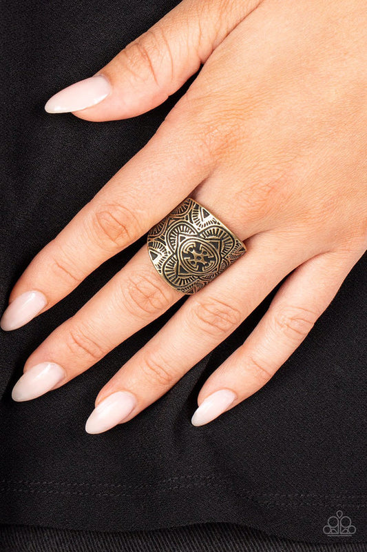 Argentine Arches - Brass Ring - Paparazzi Accessories - Engraved geometric shapes, lines, and patterns fill a brass plate that curves around the finger, creating a trendy centerpiece fashion ring.