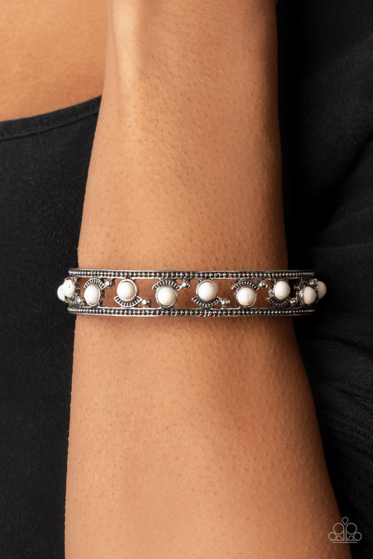Badlands Bliss - White and Silver Bracelet - Paparazzi Accessories - Dainty white stone beads are fitted in place with shiny silver studs and textured silver frames that alternate along the top and bottom of the stone pieces for an artisan inspired fashion bracelet.