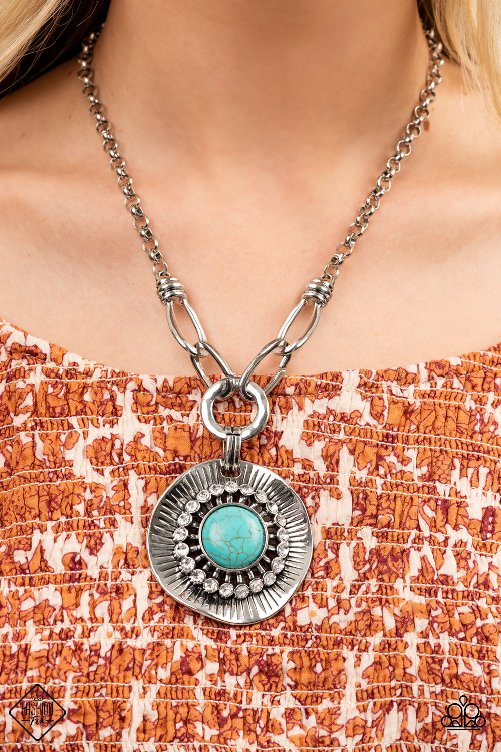 Badlands Treasure Hunt - Blue Turquoise - Silver Necklace  - Paparazzi Accessories - A circle of glassy white rhinestones fans out around an oversized turquoise stone, centered atop a warped silver disc. Etched with linear details, the earthy pendant attaches to oversized silver links, creating an artisan inspired statement piece. Features an adjustable clasp closure.