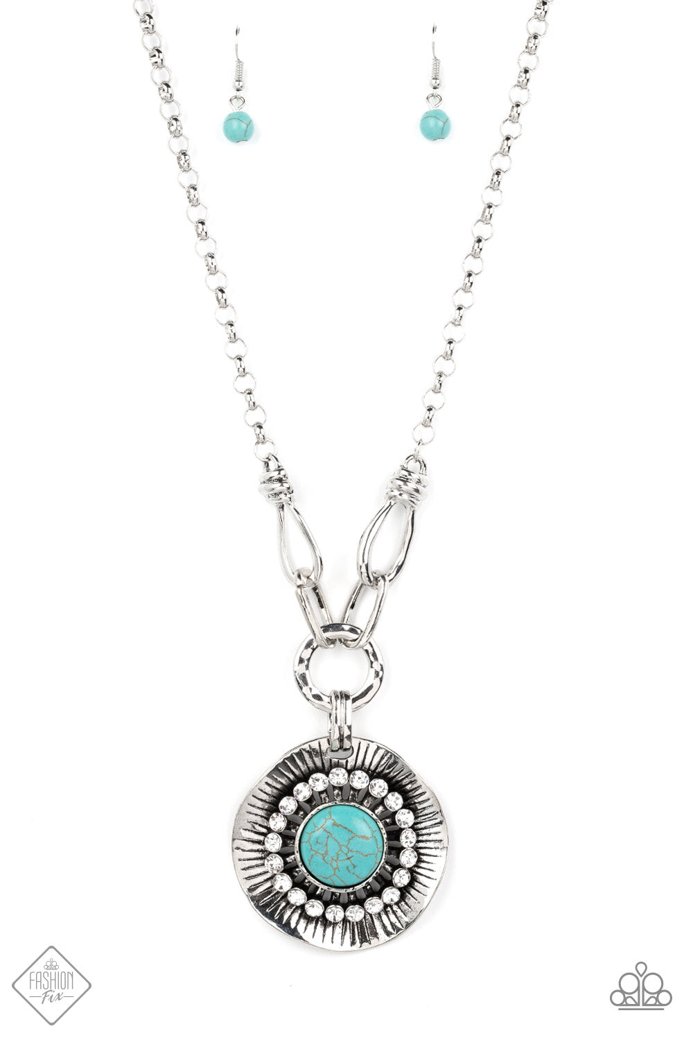 Badlands Treasure Hunt - Blue Turquoise - Silver Necklace - A circle of glassy white rhinestones fans out around an oversized turquoise stone, centered atop a warped silver disc. Etched with linear details, the earthy pendant attaches to oversized silver links, creating an artisan inspired statement necklace.
