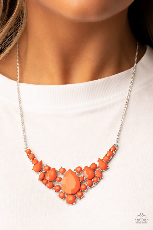 Bali Ballroom - Orange and Silver Necklace - Paparazzi Accessories - A faceted collection of round, teardrop, and marquise style orange beads coalesce around an oversized orange teardrop bead, resulting in a dramatic centerpiece below the collar.