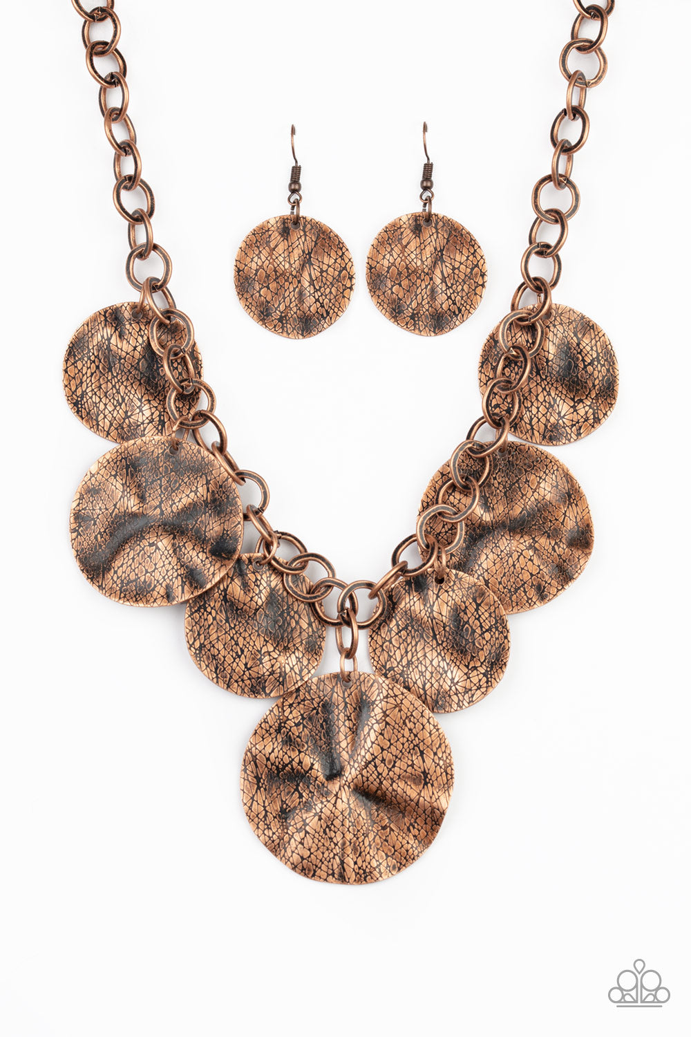 Barely Scratched The Surface - Copper Fashion Necklace - Paparazzi Accessories - Scratched in antiqued shimmer, warped copper discs swing from the bottom of a thick copper chain, creating a bold fringe below the collar. Features an adjustable clasp closure. Sold as one individual necklace.
