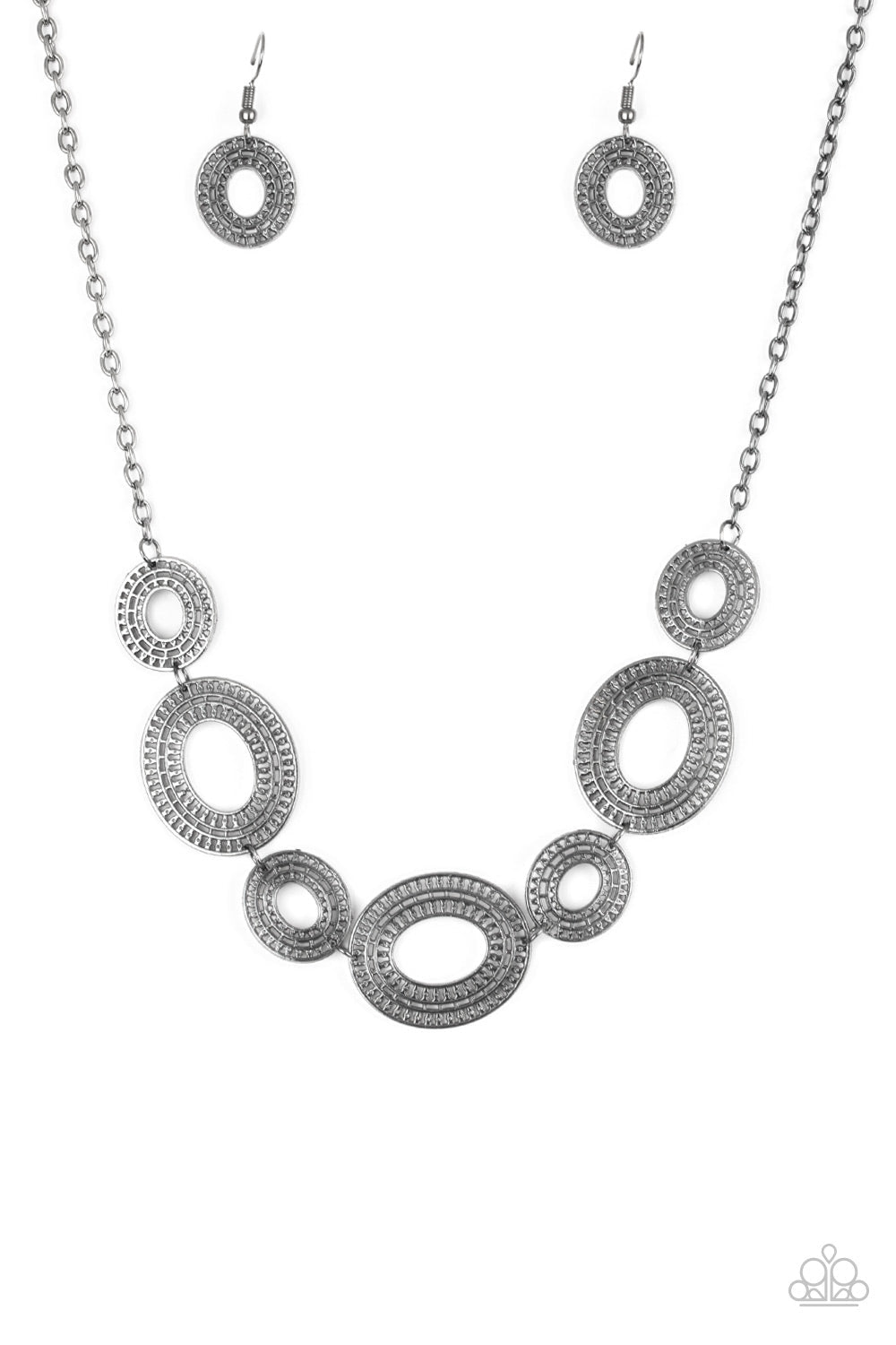 Basically Baltic - Black Metal ( Gunmetal ) Necklace - Paparazzi Accessories - Radiating with circular details, airy oval frames link below the collar for a casual stylish necklace.