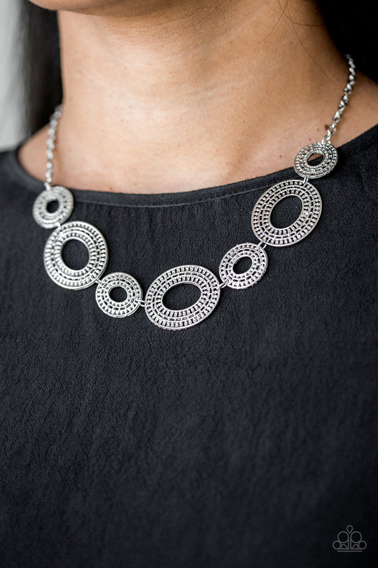 Basically Baltic - Silver Necklace - Paparazzi Accessories - Radiating with circular details, airy oval frames link below the collar for a casual look. Features an adjustable clasp closure. Sold as one individual necklace. Includes one pair of matching earrings.