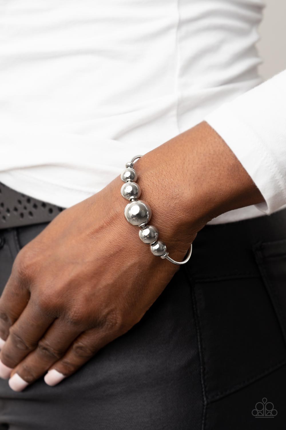 Bead Creed - Shiny Silver Cuff Bracelet - Paparazzi Accessories - Oversized collection of shiny silver beads are threaded along a dainty silver cuff for a dramatic industrial stylish fashion bracelet.