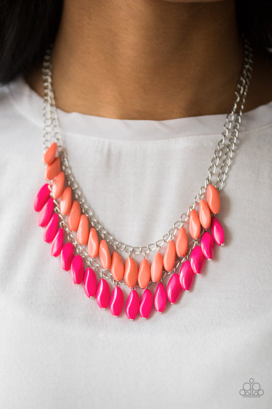 Beaded Boardwalk - Pink and Coral Necklace - Paparazzi Accessories - A row of faceted Living Coral beads swings above a row of faceted pink beads, creating a vivacious double fringe below the collar. Features an adjustable clasp closure. Sold as one individual necklace.