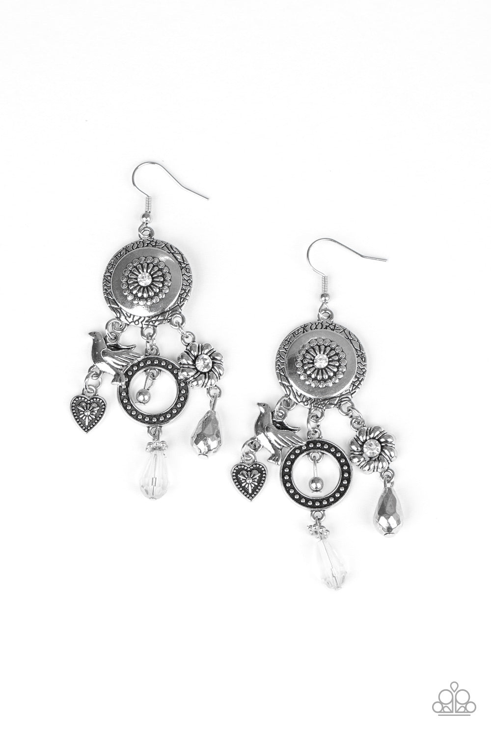 Springtime Essence - Silver Earrings - Paparazzi Accessories - Infused with glittery white rhinestones and crystal-like accents, a whimsical display of silver heart, flower, and bird charms dance from the bottom of a decorative floral silver frame, creating a noisy fringe. Earring attaches to a standard fishhook fitting. Sold as one pair of earrings.