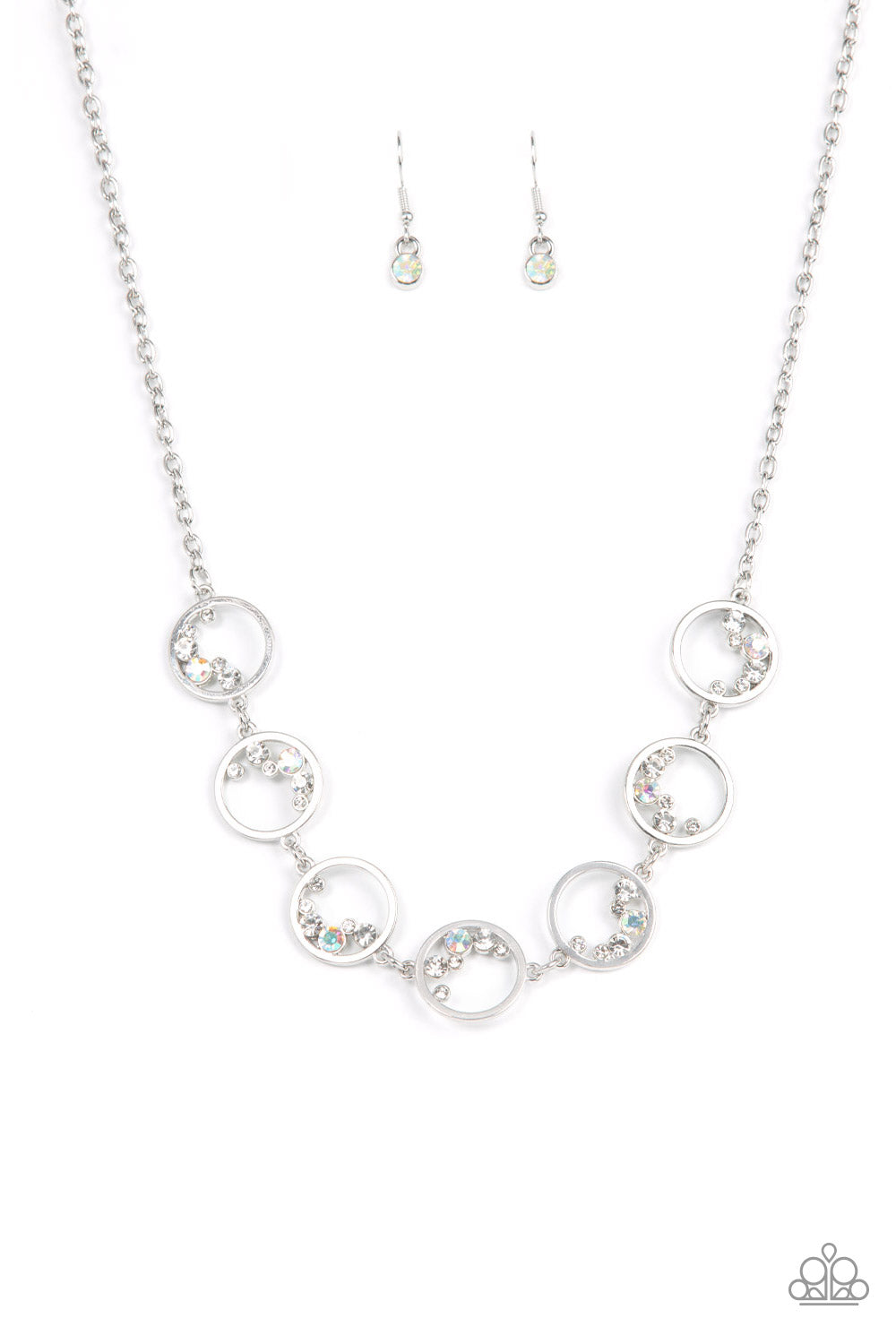 Blissfully Bubbly - White and Silver Necklace - Paparazzi Accessories - A dainty series of shiny silver rings are sporadically dotted in bubbly rows of glassy and iridescent white rhinestones as they delicately link below the collar, resulting in an effervescent display. Features an adjustable clasp closure stylish necklace. 