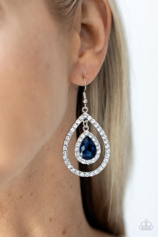 Blushing Bride - Blue Gem - Silver Earrings - Paparazzi Accessories - Blue teardrop gem, encased in a sparkling white rhinestone frame, creates a striking pendant as it dangles inside an airy teardrop frame encrusted with white rhinestones and culminates into a mesmerizing stylish earrings.